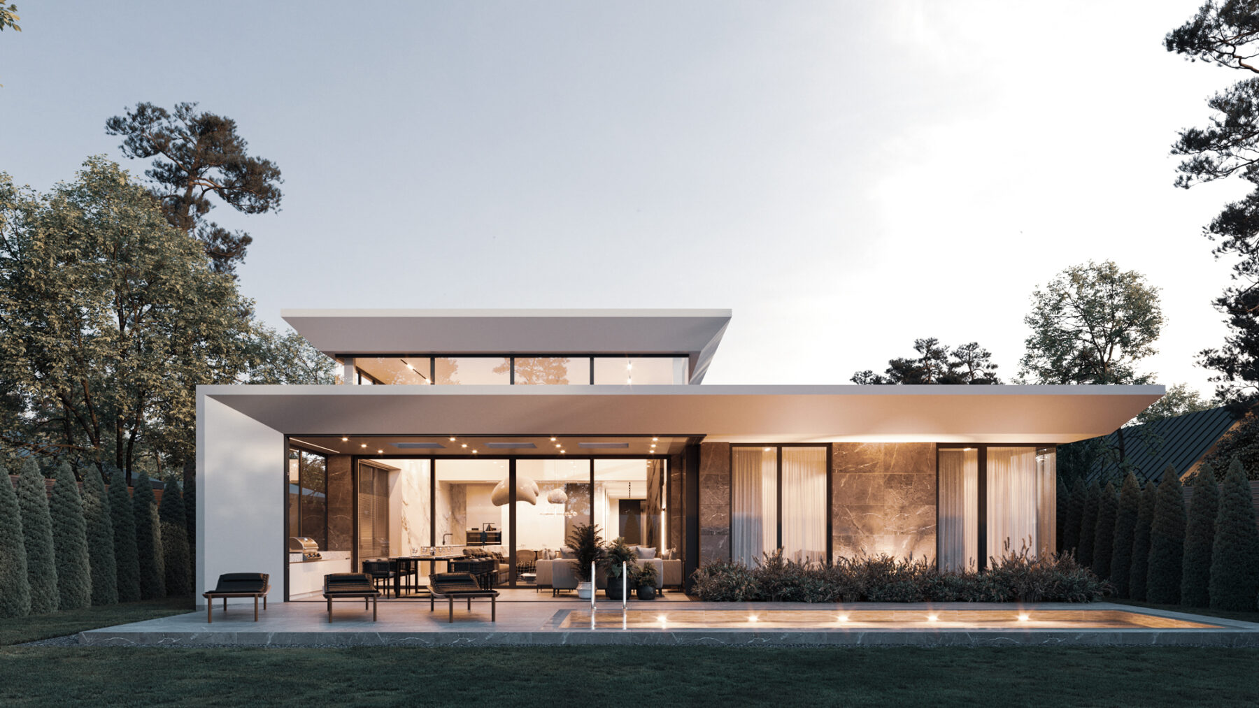 A contemporary new build house lit at dusk